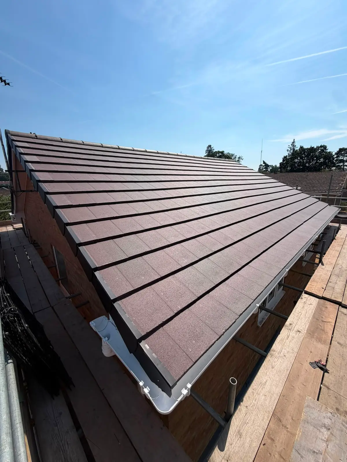 Completed new tiled roof with fresh fascias and guttering on a home in Newbury