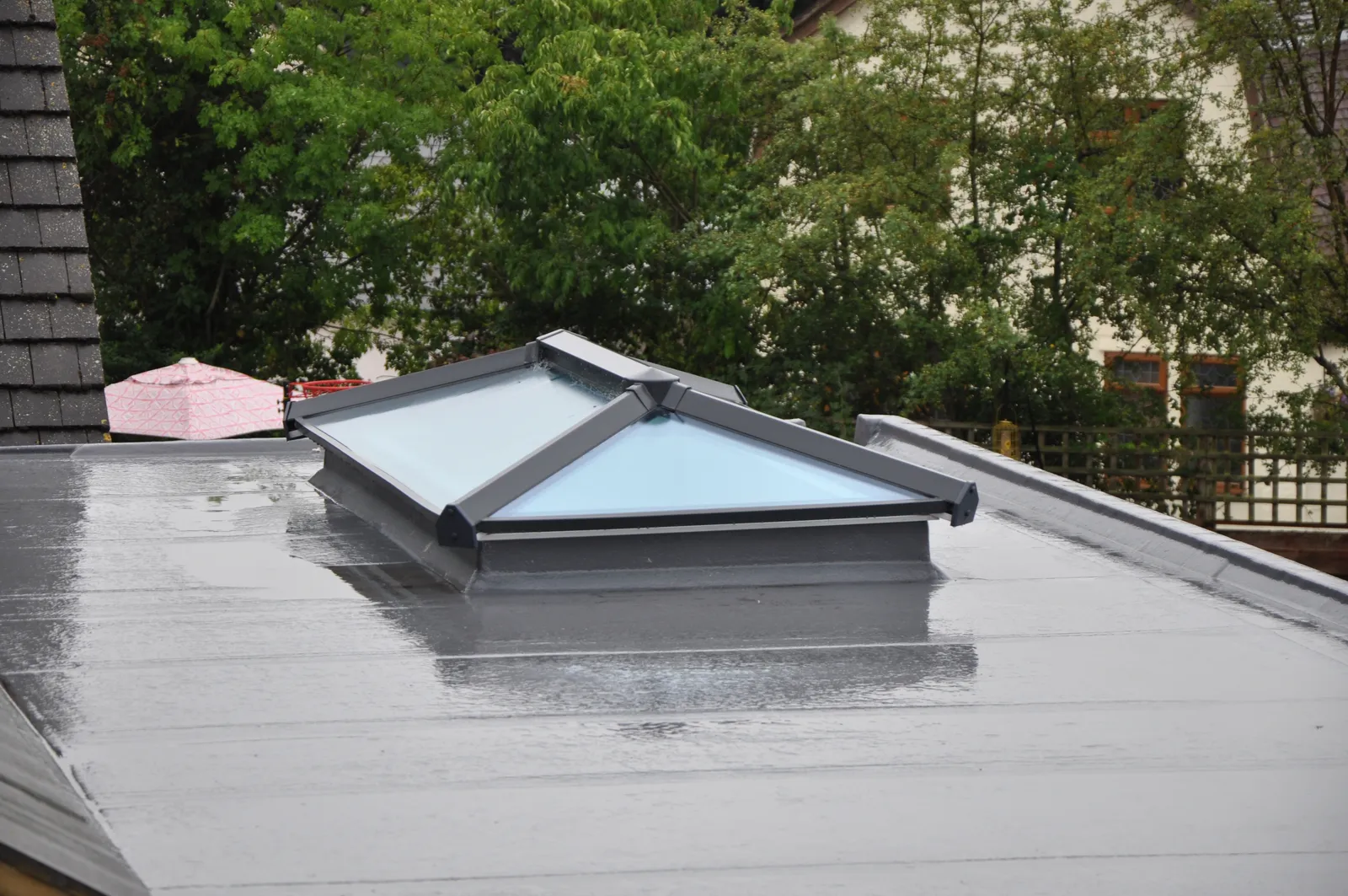 Flat roof grey single ply membrane glass lantern skylight